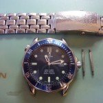 The new Omega sapphire glass is fitted - now the service can proceed.